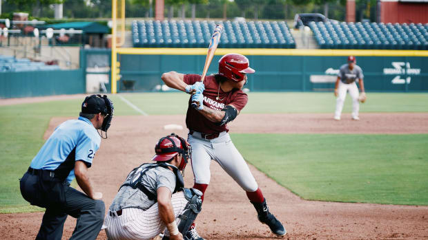 Wehiva Aloy bats during a fall scrimmage for Arkansas